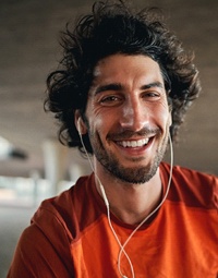 a person working out while listening to music and smiling