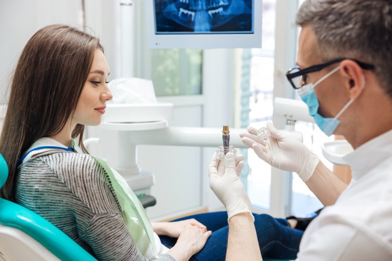 woman smiling talking to dentist