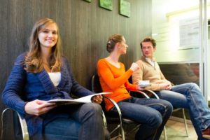 Busy waiting room at Burleson dentist's office before COVID-19