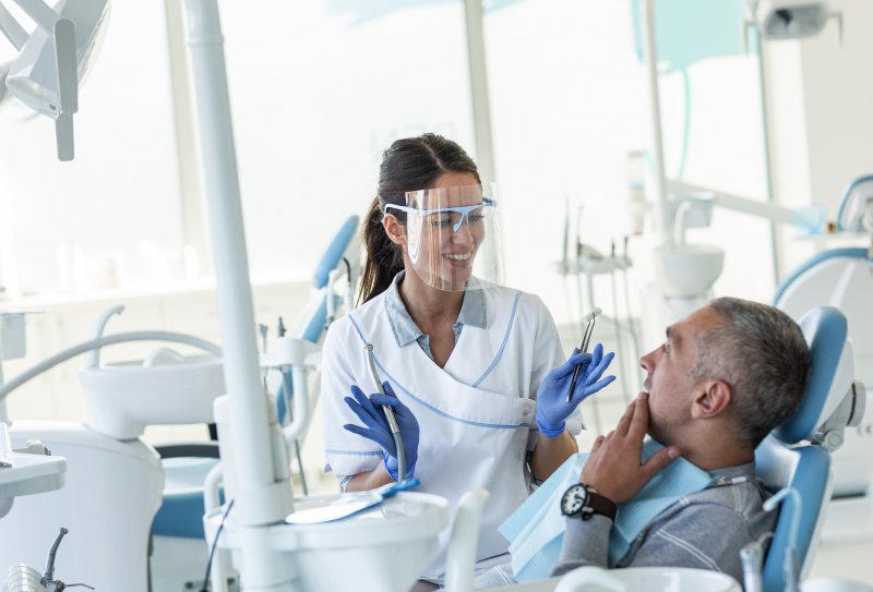 Dentist in Burleson talking to patient