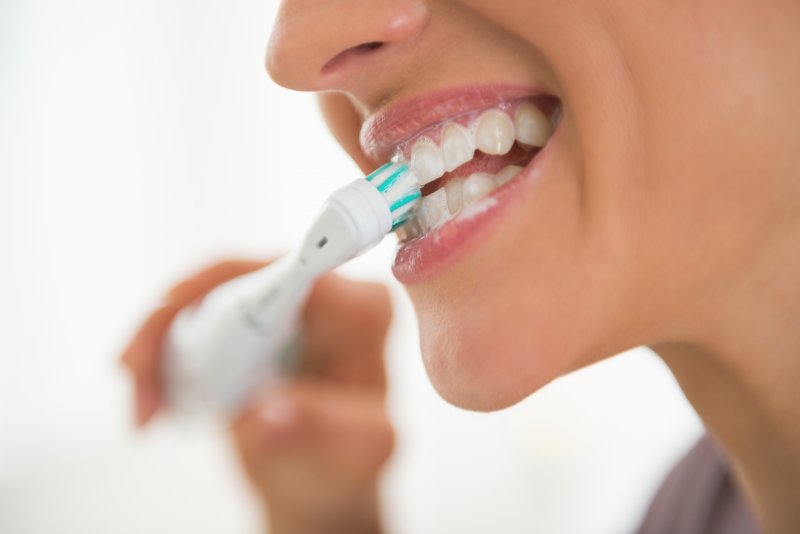 Woman brushing her teeth