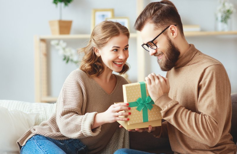 person giving Valentine’s Day gifts to partner