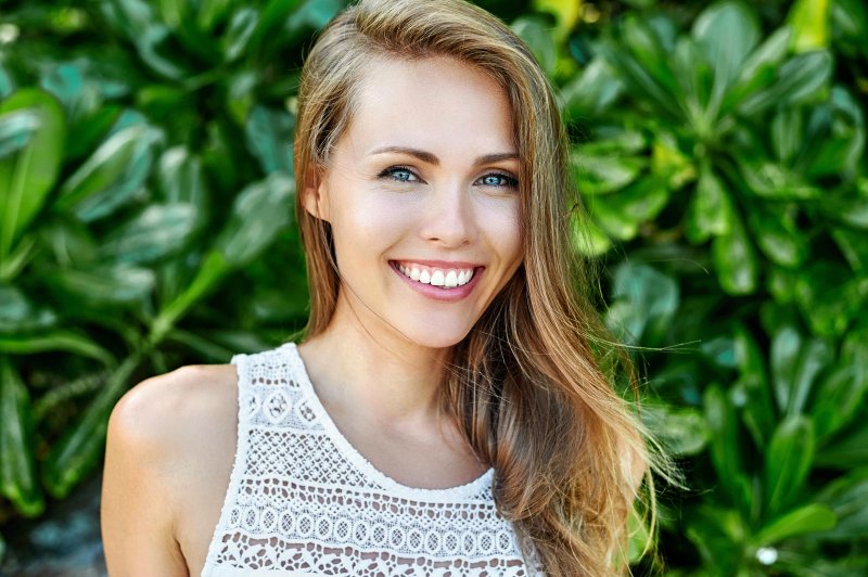 woman smiling with white teeth in summer