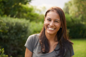 a patient with a healthy smile enjoying the summer weather 