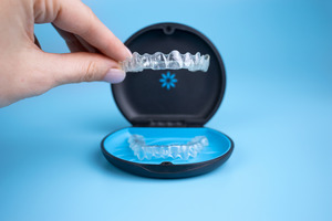 Taking Invisalign aligner out of its case