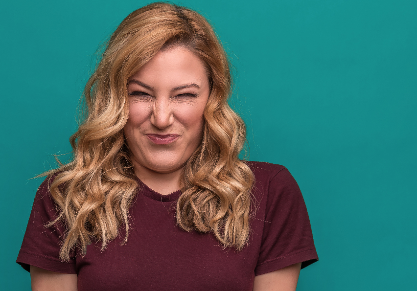 Woman making sour face